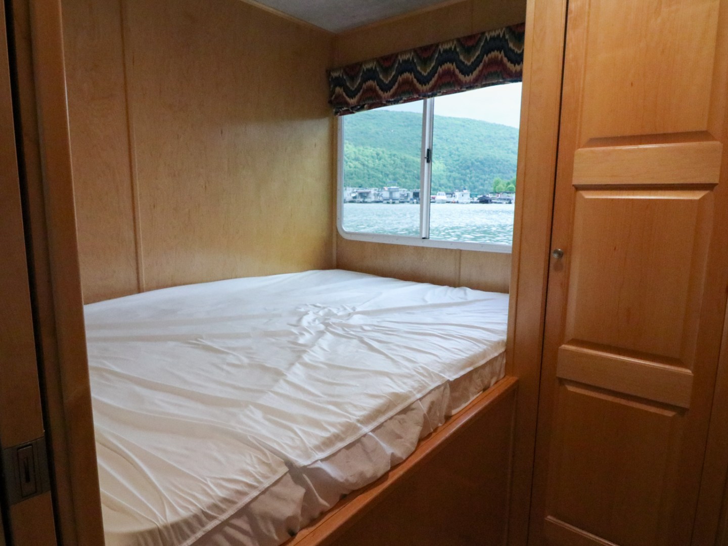 a bedroom with a bed and a window