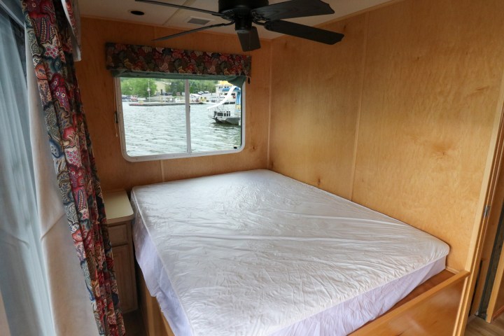 a bedroom with a bed and a mirror