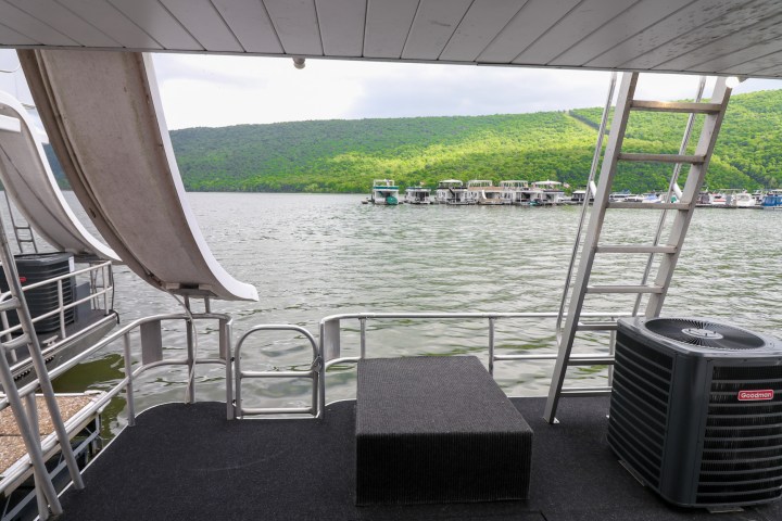 a chair sitting in front of a fence