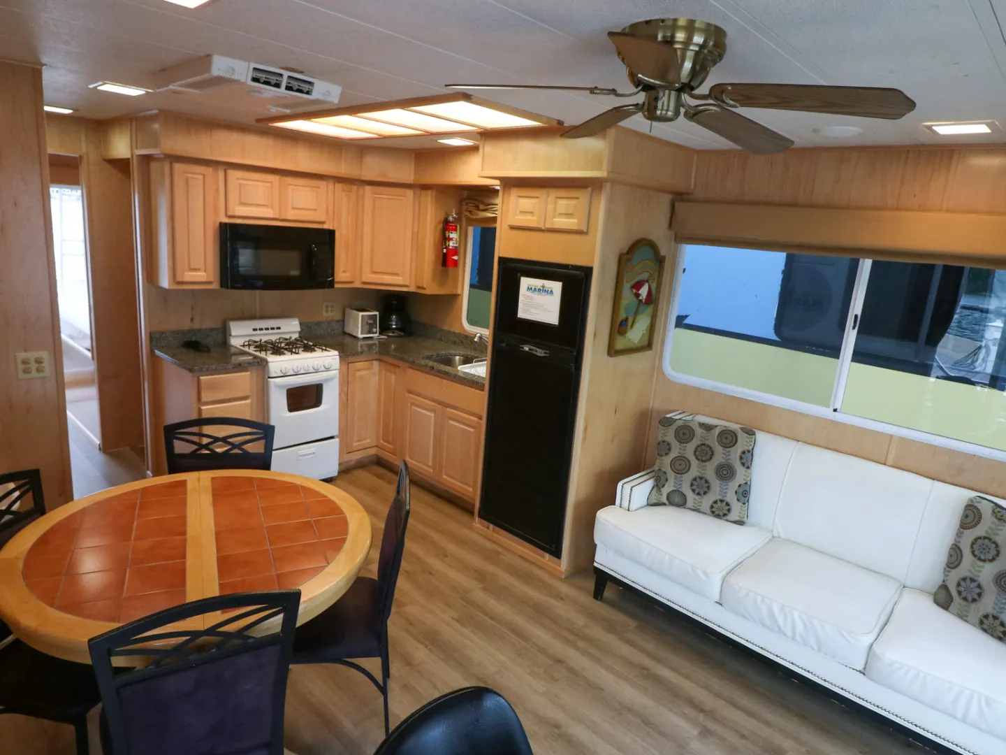 a kitchen with a stove top oven sitting inside of a room