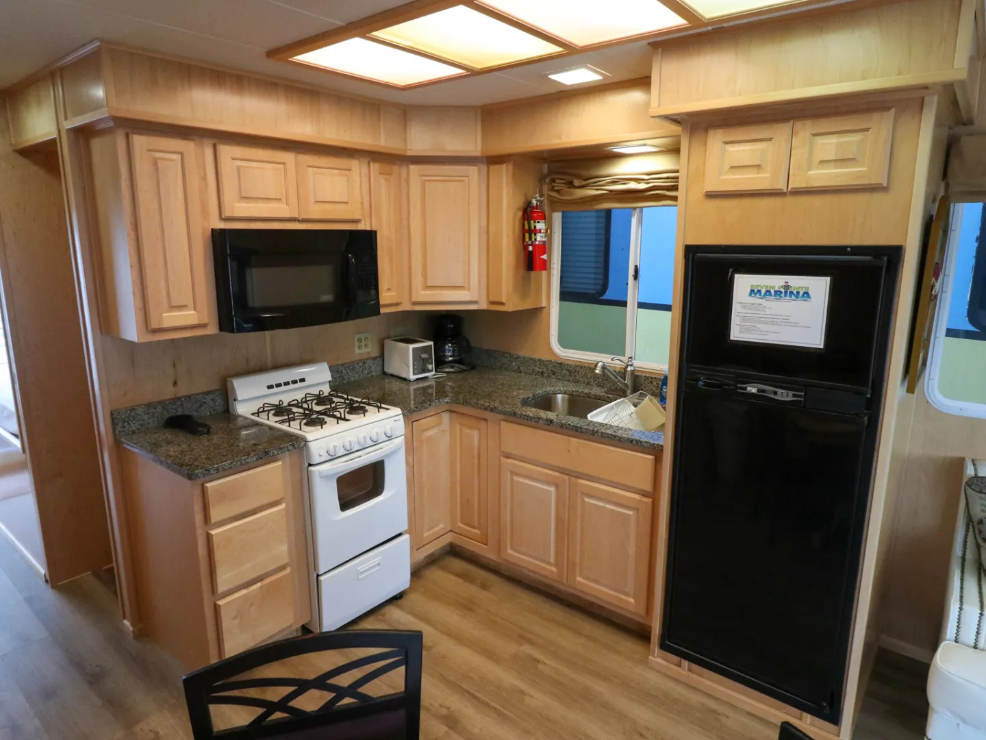 a kitchen with stainless steel appliances and wooden cabinets