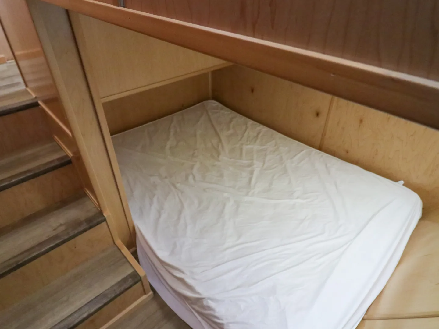 a bed with a wooden table
