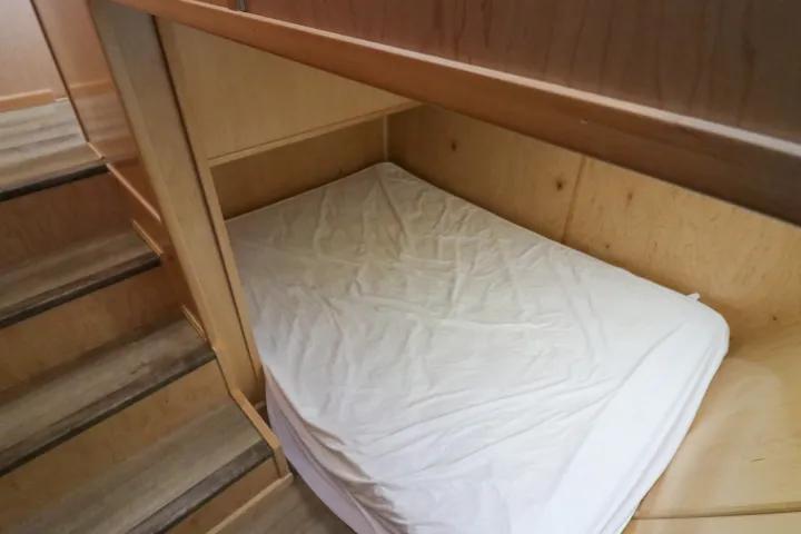 a bed with a wooden table