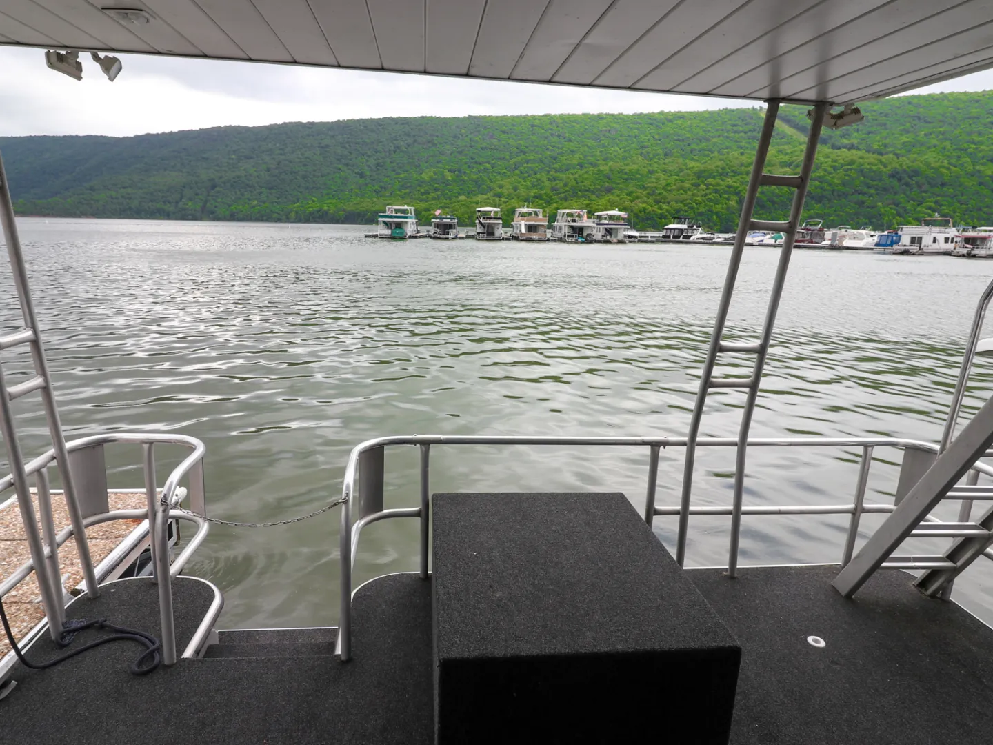 a chair sitting in front of a body of water