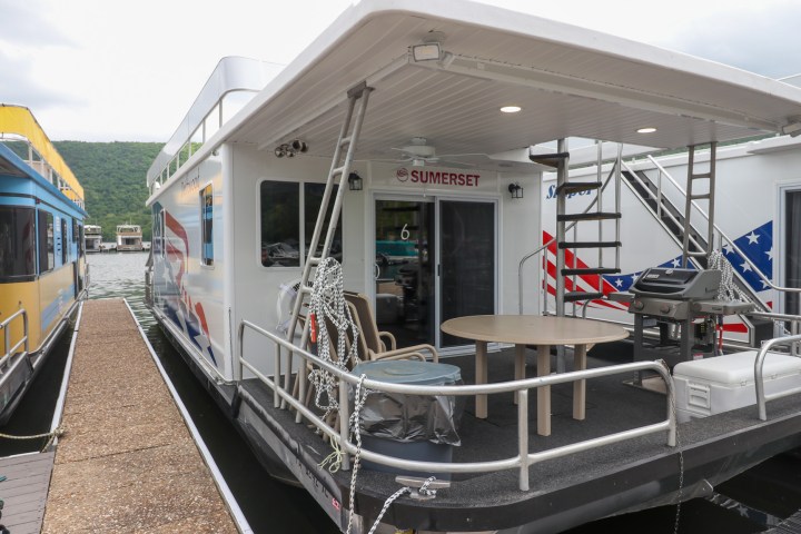 a train is parked on the side of a building