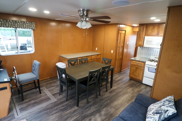 a living room filled with furniture and a stove
