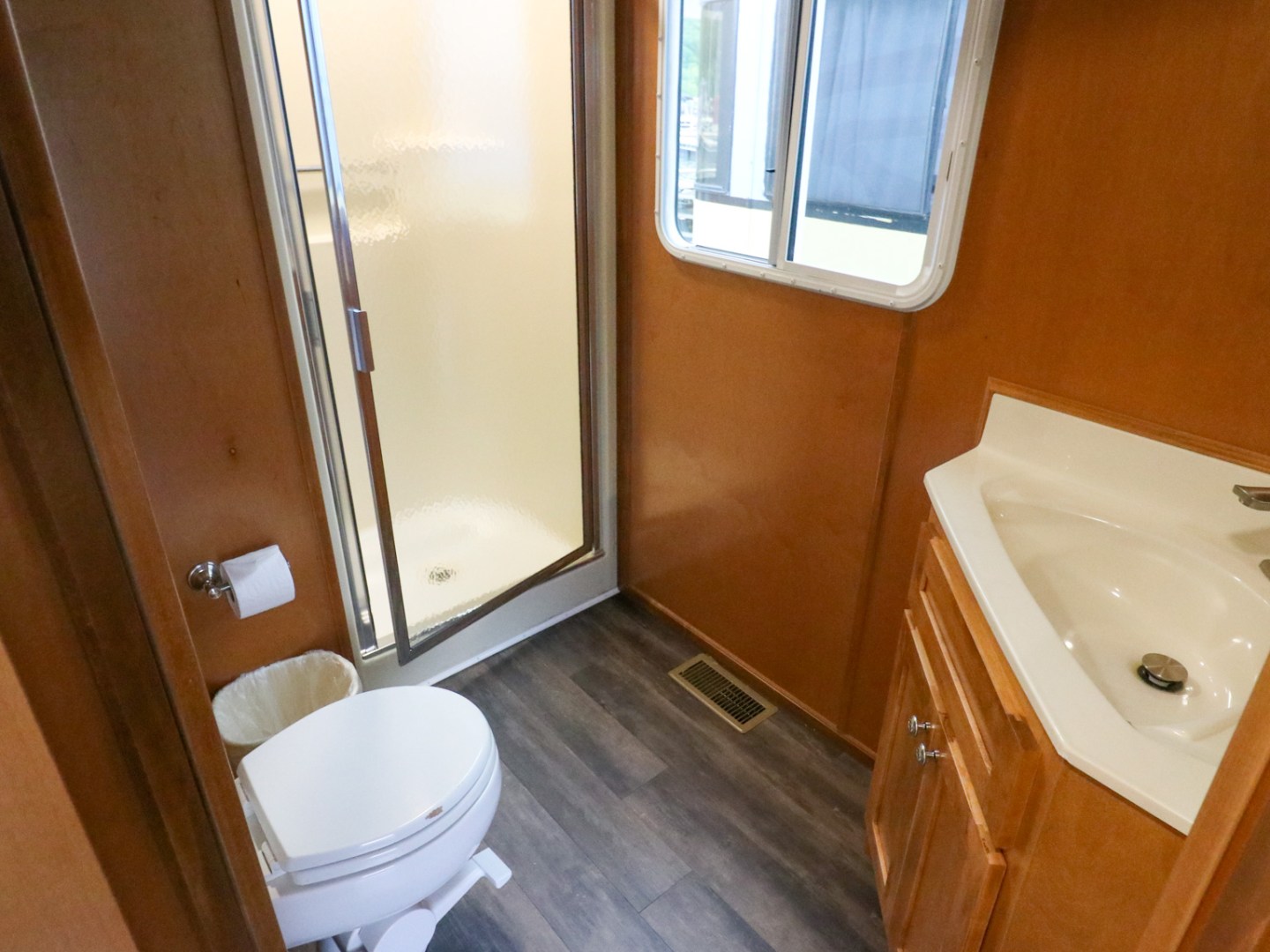 a sink sitting under a window