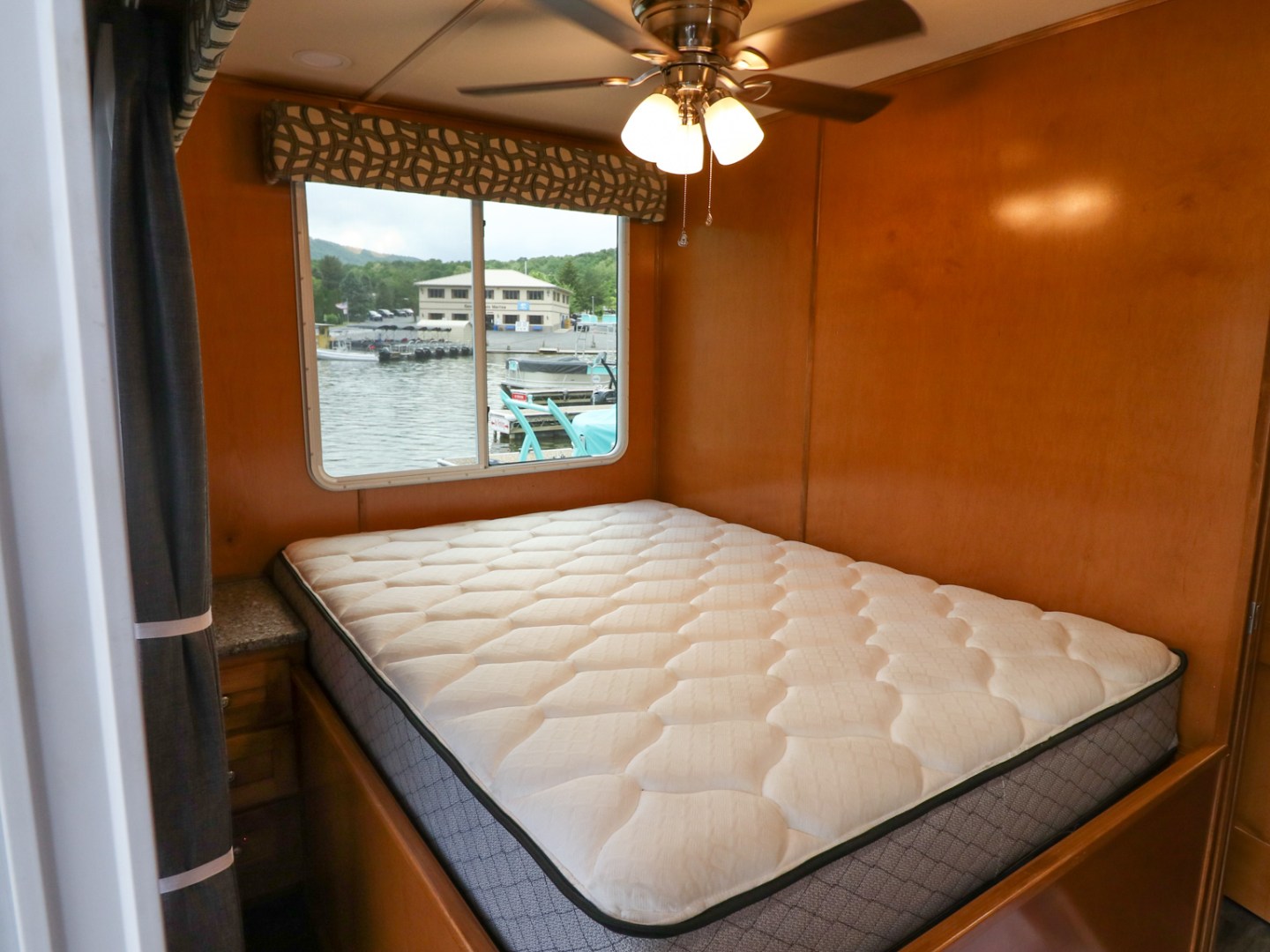 a bedroom with a large window