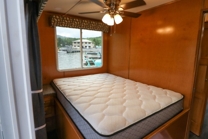 a bedroom with a large window