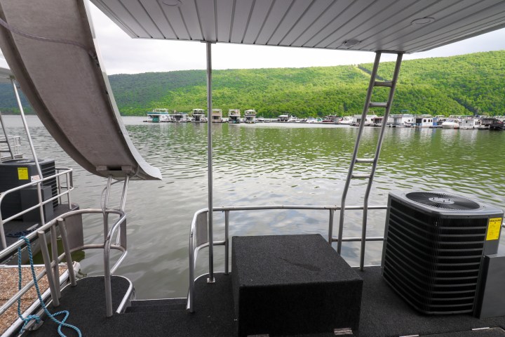 a chair sitting in front of a body of water