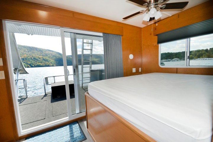 a bedroom with a bed and a window