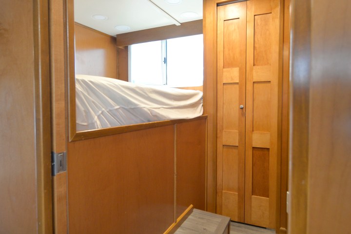 a bedroom with a bed and a mirror