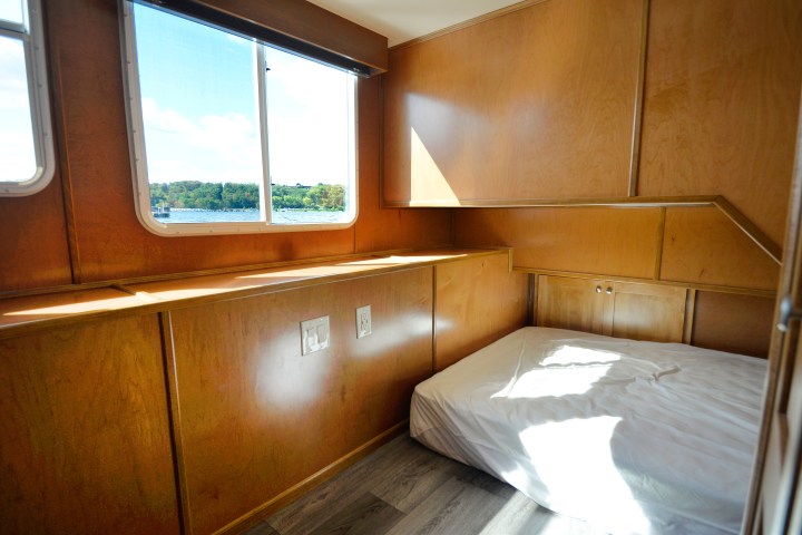 a bedroom with a bed and a window