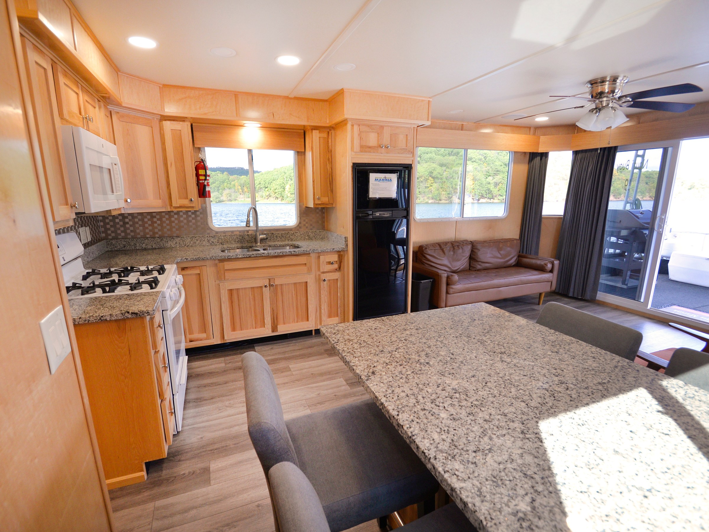 a living room with a fireplace and a large window