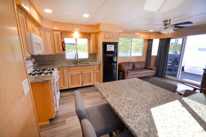 a living room with a fireplace and a large window